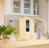 a kitchen sink with a water purifier on it